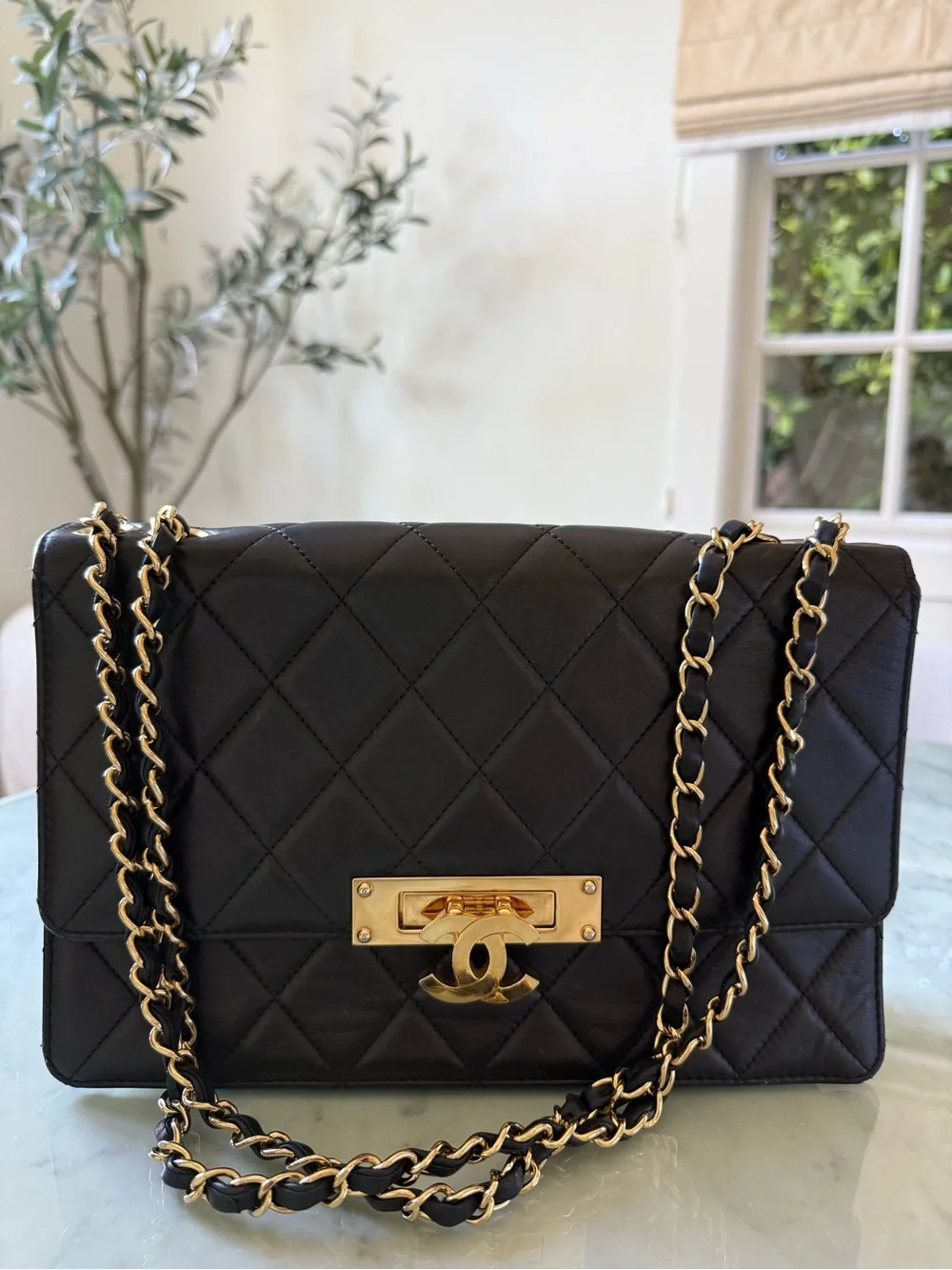 CHANEL Black Quilted Shoulder Bag with Gold Hardware